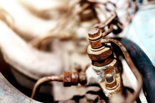 Small STEP RGB Web-Old Rustic knot and rusty iron chains on engine of motor car.jpg